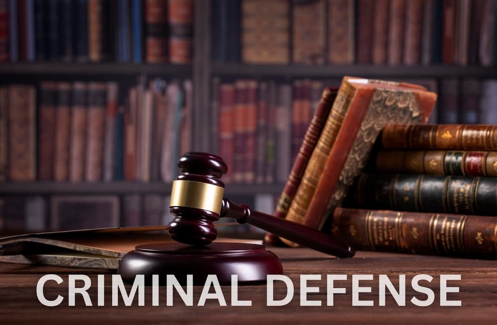 Criminal defense, featuring a gavel, handcuffs, and legal documents on a desk