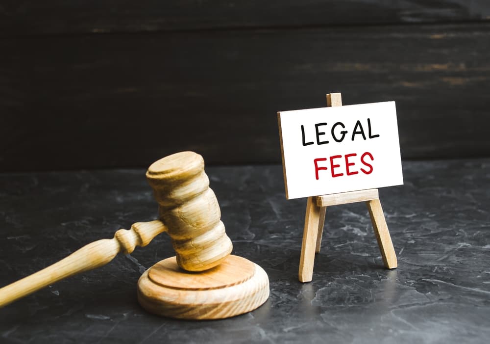 Legal Fees written on a Board with Judge's hammer